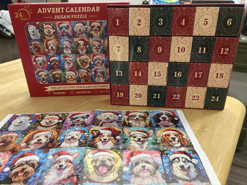 Customer photo: the finished dog puzzle beside the box and its 24 doors